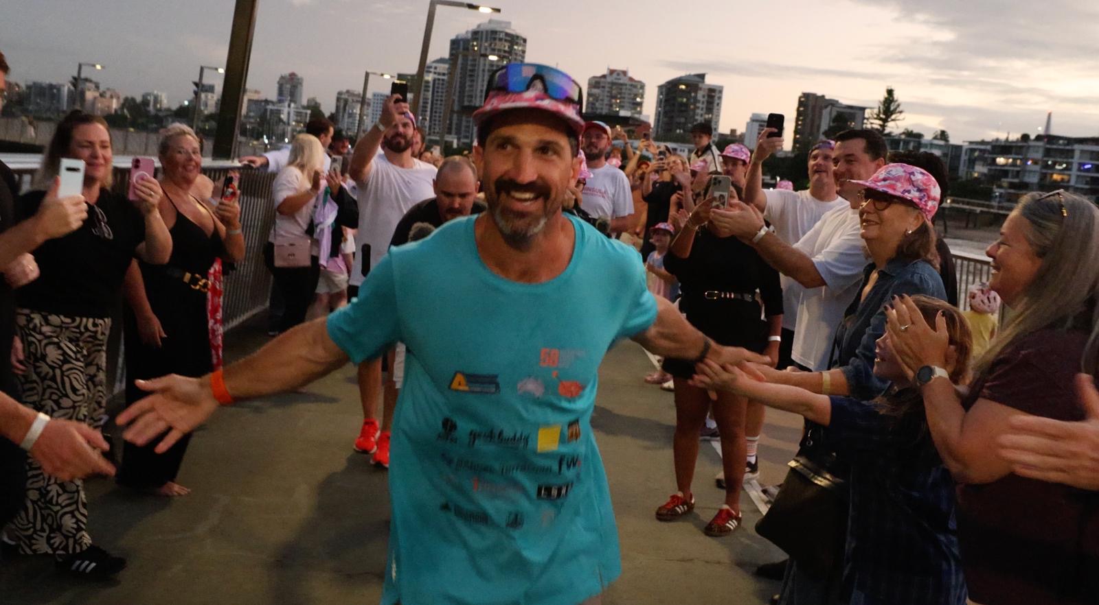 Lachlan Stuart speaking to crowd at Brisbane finish - leading by example