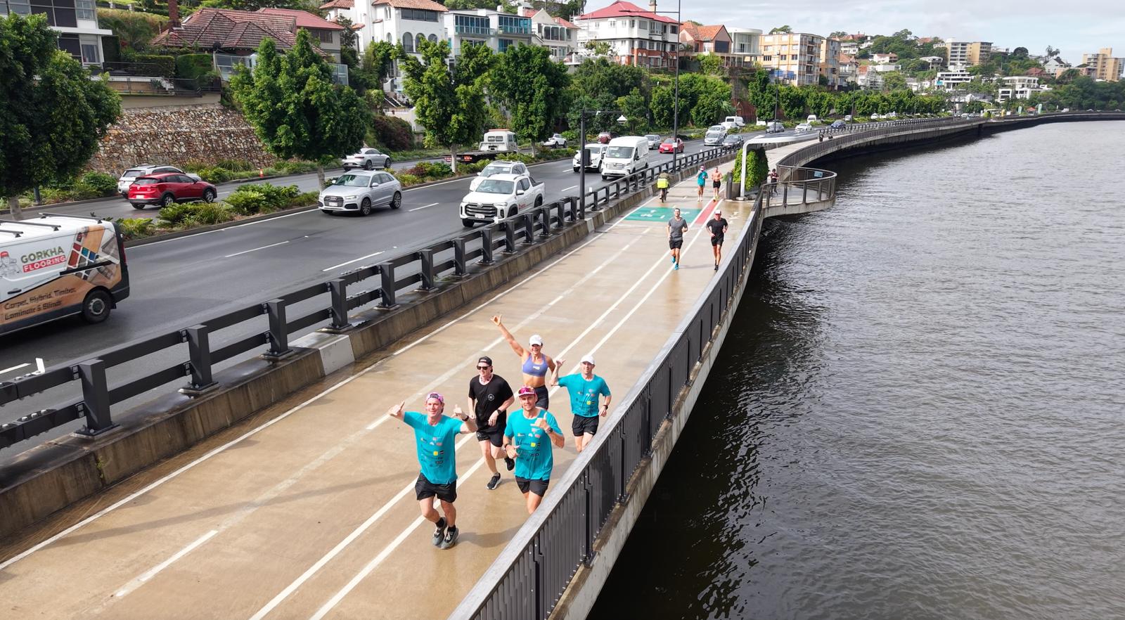 Aerial view of a group running together along the Brisbane riverwalk