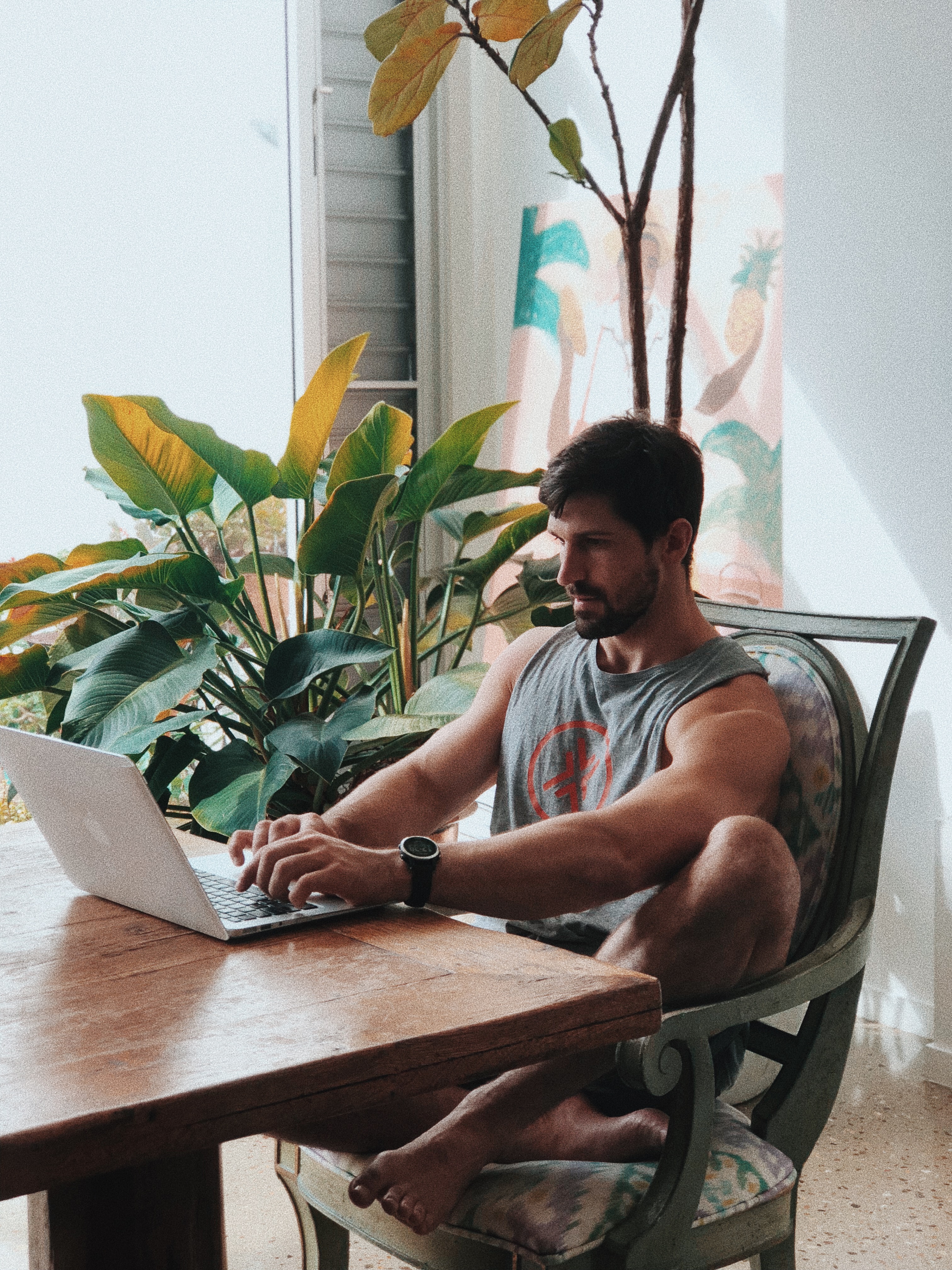 Man writing in journal with morning light